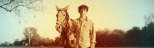 The Right Horse - Boy Standing with Horse